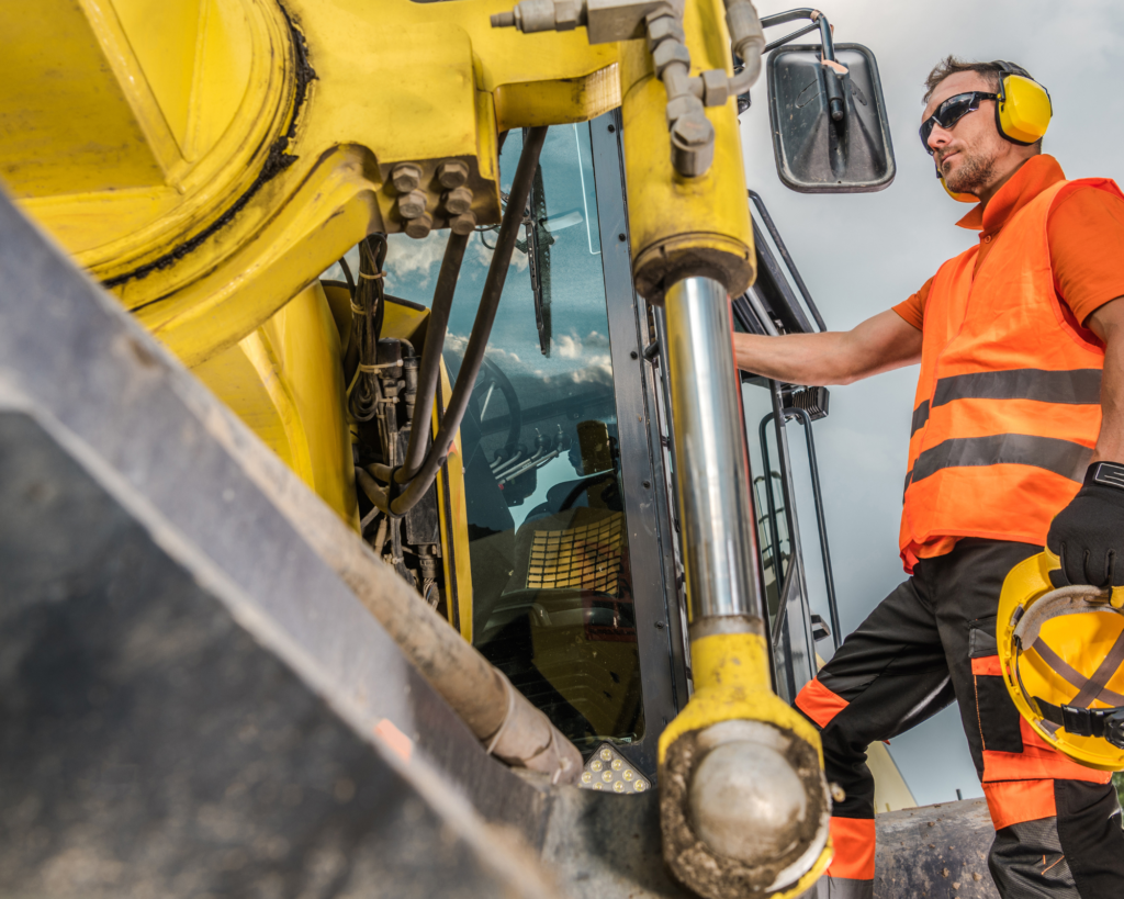 Do You Need a CSCS Card if You Have a CPCS Card?: a man operating a heavy machinery in a construction site