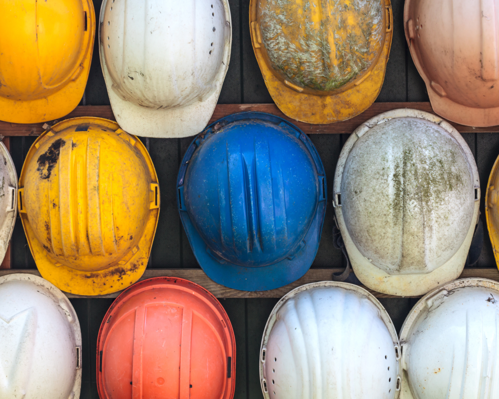 Jobs You Can Apply For With A CSCS Labourer Card: Construction workers dirty hard hats