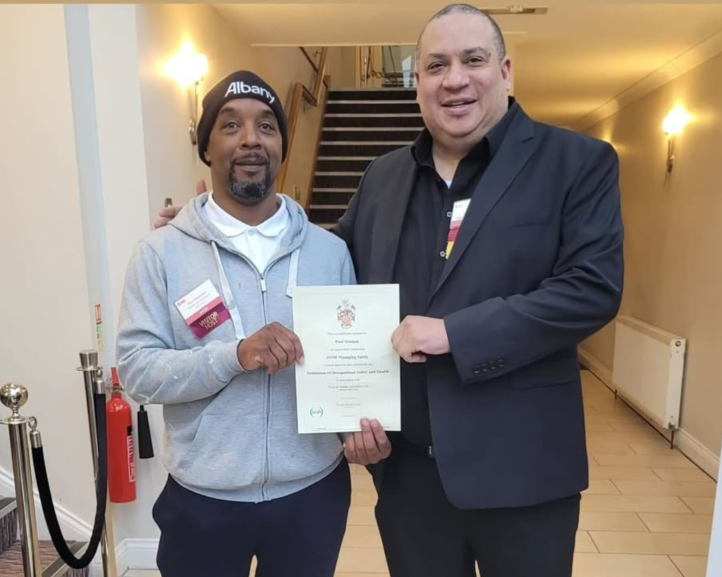 How To Pass The IOSH Managing Safely Risk Assessment Project: Sam with a student displaying his IOSH certificate